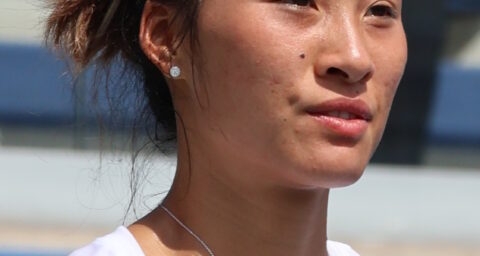 Qinwen Zheng em quadra durante o US Open